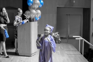 Little girl graduating on stage